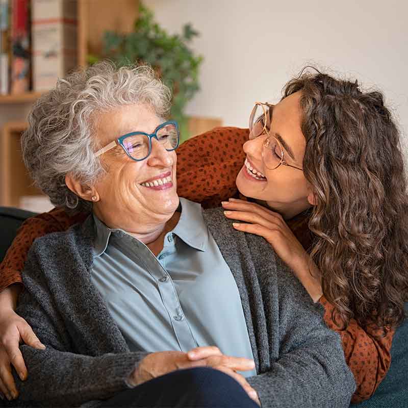 Granddaughter and grandmother laughing together