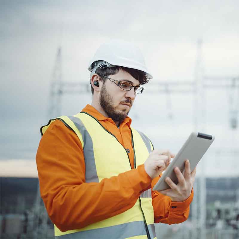 Construction worker wearing ear molds protection. 