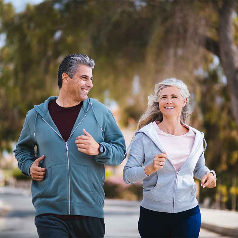 Active middle age couple out for a jog